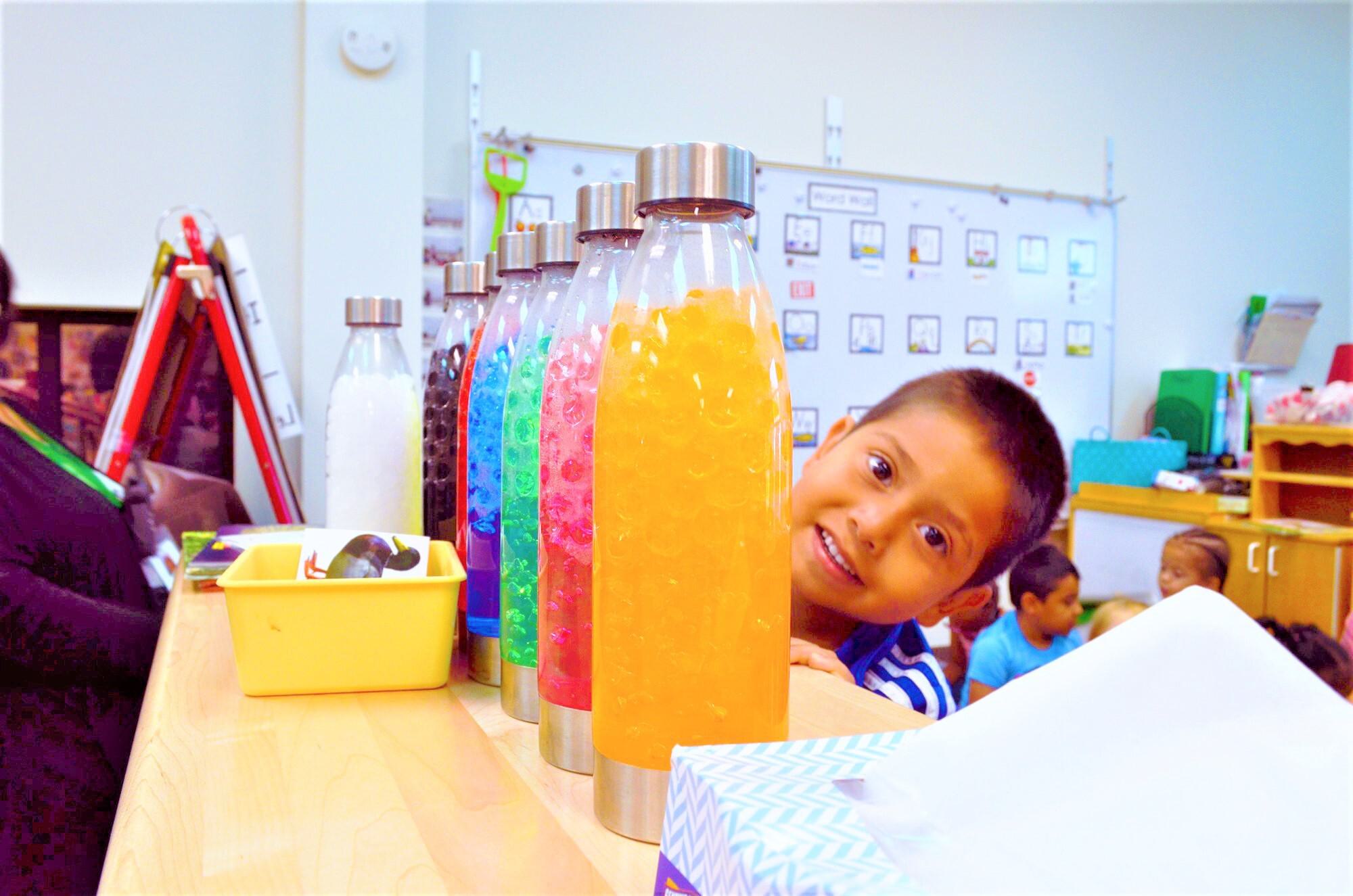 Boy with colored bottles CTA